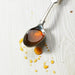 Spoon with raw unpasteurised pure organic honey zambian